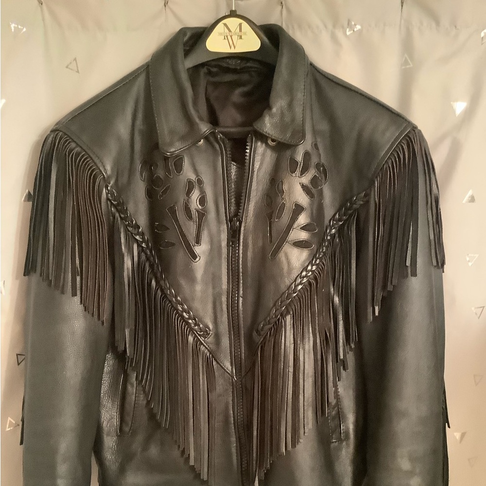 Beautiful black leather coat.  It fits perfect but arms are a little too short…